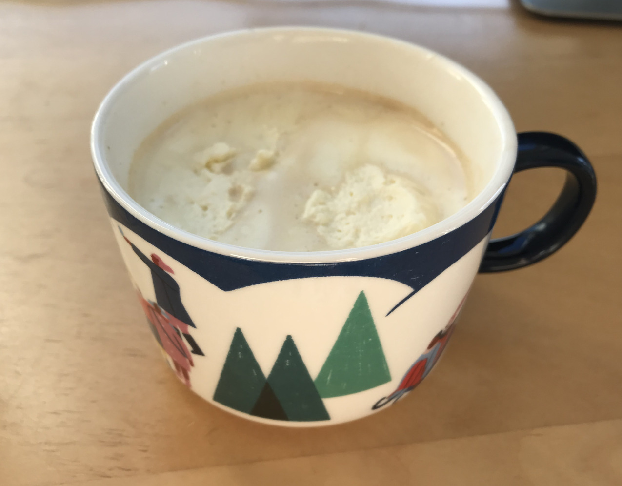 A cup of coffee with cream
