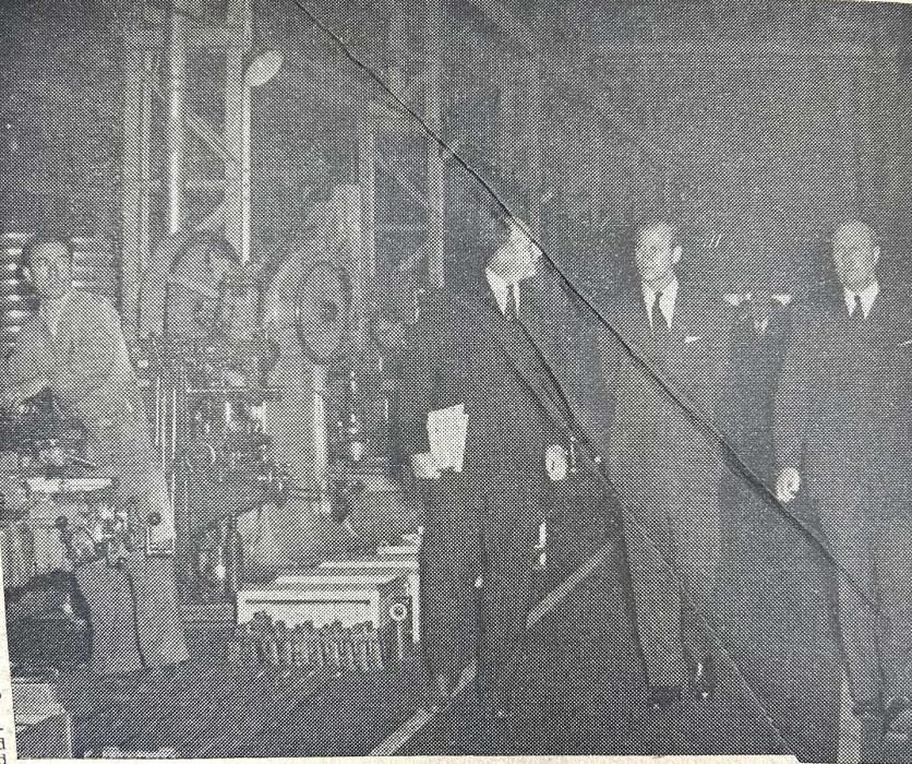 Prince Phillip walks with others in a factory, Wokingham and Bracknell Times, 22nd April 1955 ref. NTB/G26/1/4