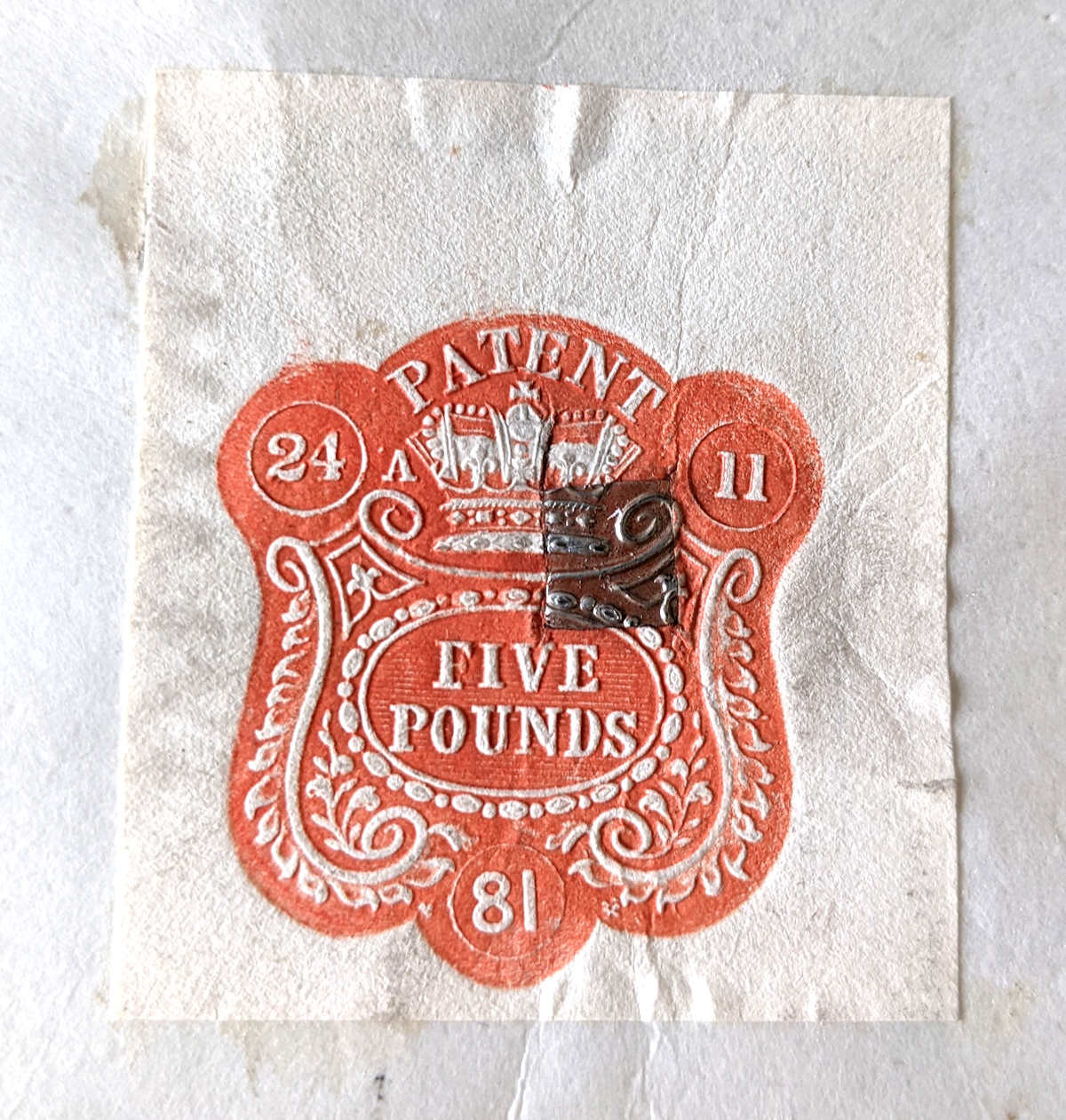 Five pound stamp on letters patent 1881
