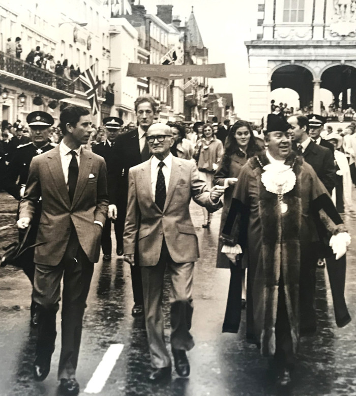 Prince of Wales walks on a road with other people on a visit to Windsor 1980 ref. D/EX1951/10/8/10
