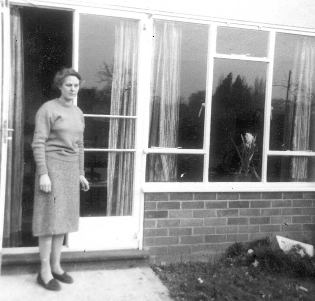 Angela Green County Archivist of the RBA 1967 to 1979 standing outside a building.